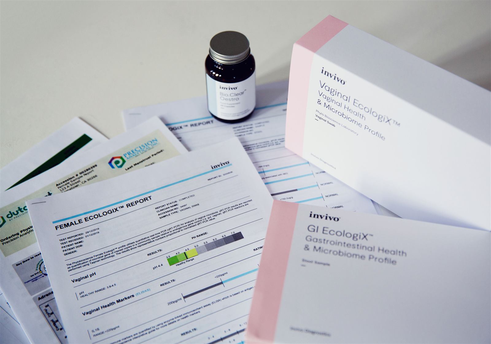 Functional test kits and lab reports laid out on a desk