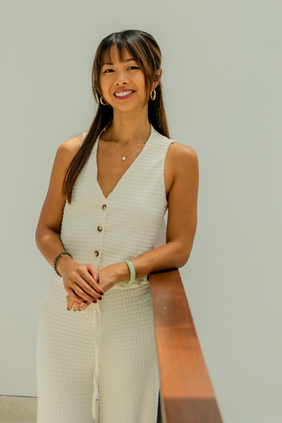 Laura Lam, registered nutritional therapist, smiling by a sunlit window